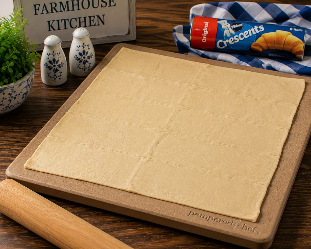 crescent roll dough flattened into a rectangle to fill with chicken and broccoli