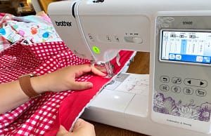 Red binding sewn along the raw quilt edge.