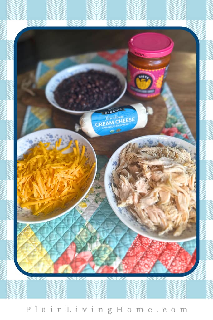 chicken, cheese, black beans, cream cheese, and enchilada sauce