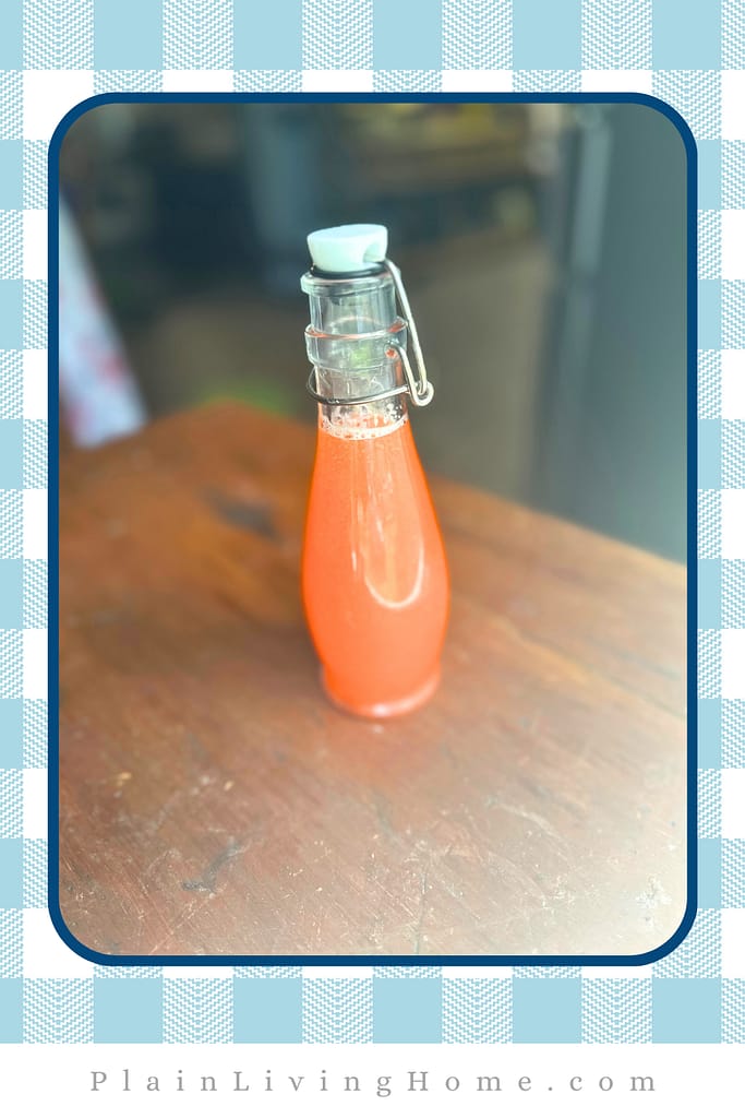 a single serving jar of homemade strawberry lemonade
