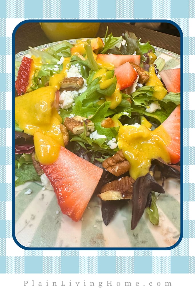 homemade honey mustard drizzled over a fresh green salad