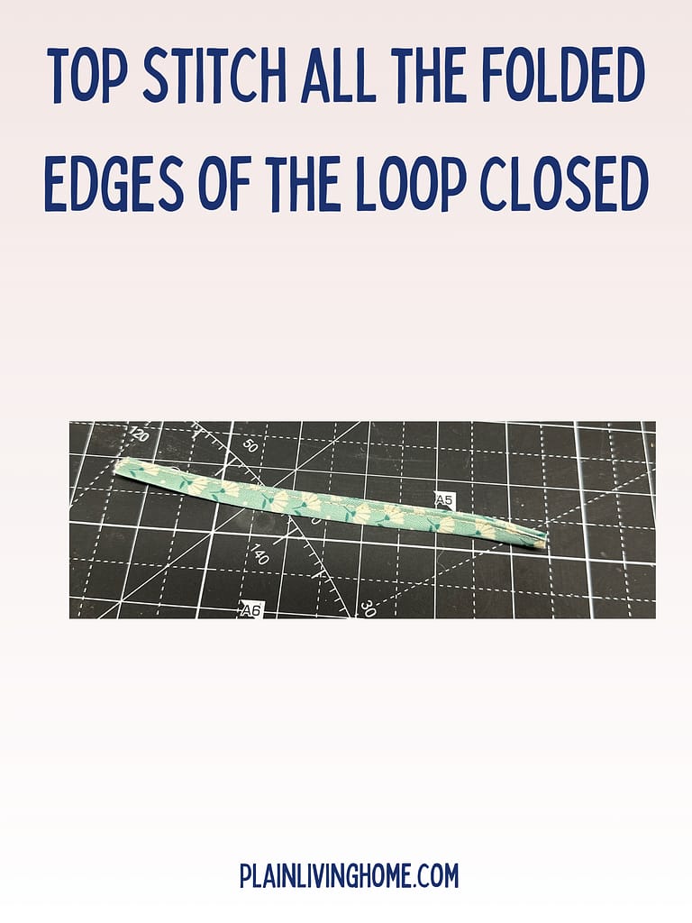 a long strip topstitched for a loop on the hanging hot pad
