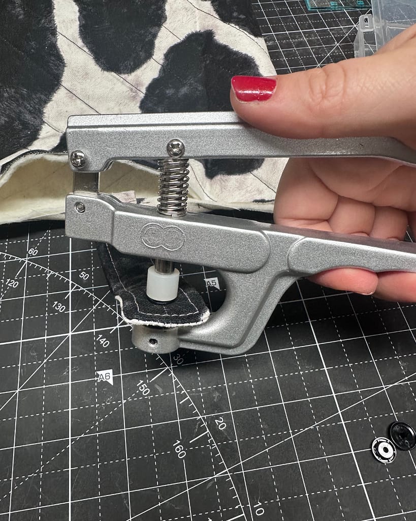 Installing a KAM snap closure on a quilted book sleeve