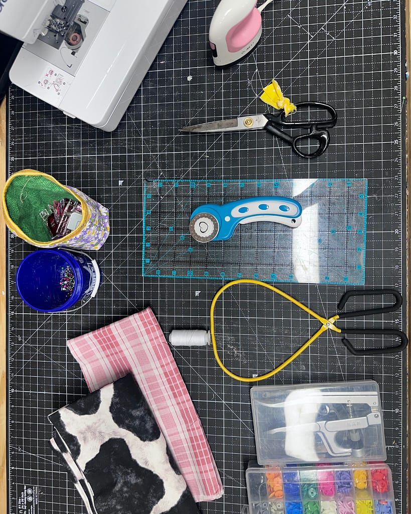 Fabric batting thread and supplies for sewing a quilted book sleeve