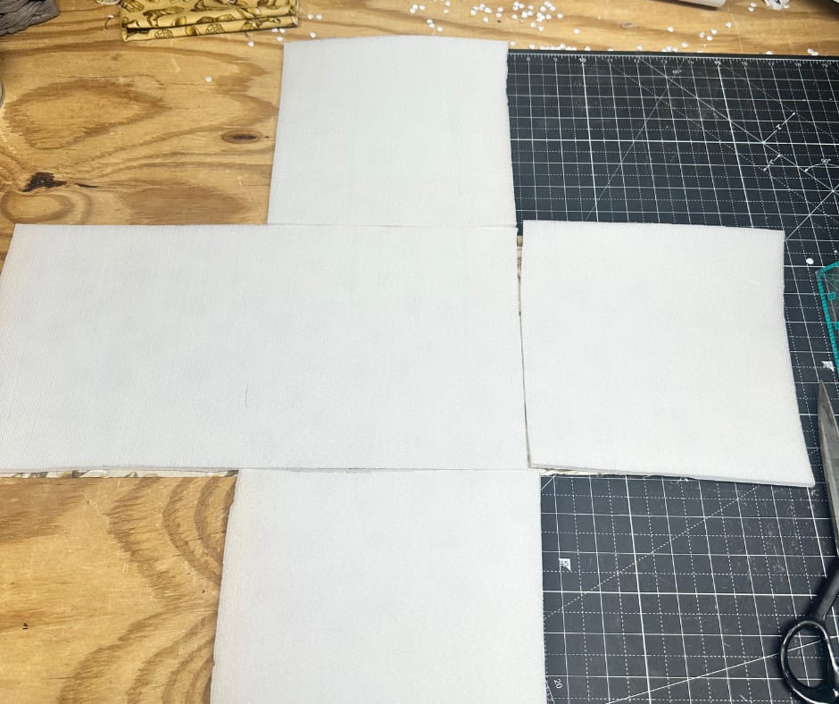 you may have to piece the foam together to make the cross shape