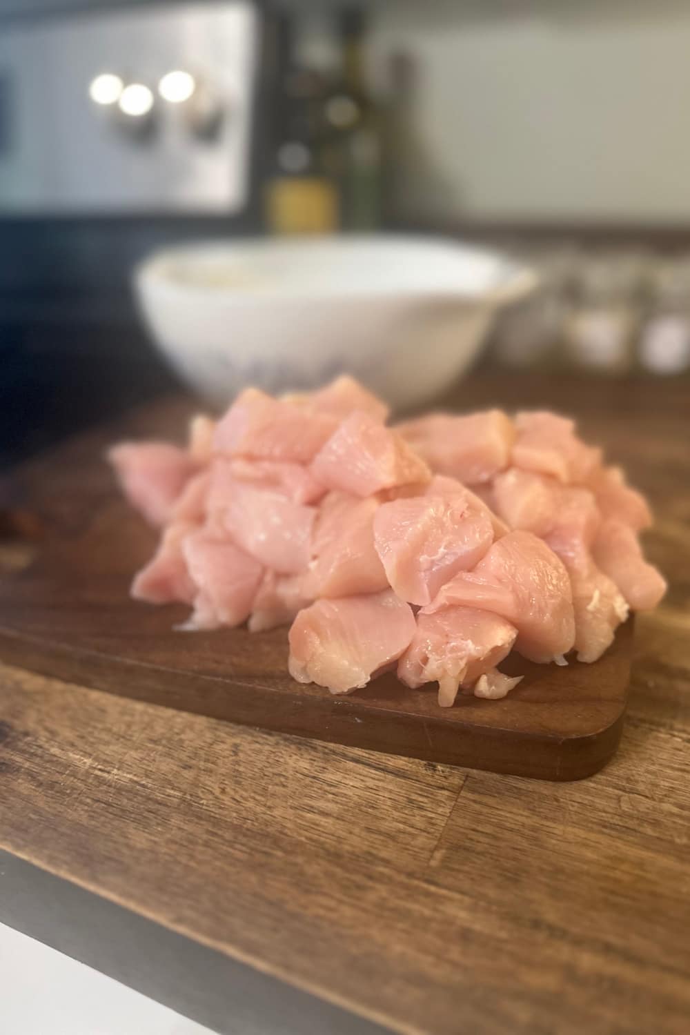 cubed up chicken in bite size for greek chicken bites