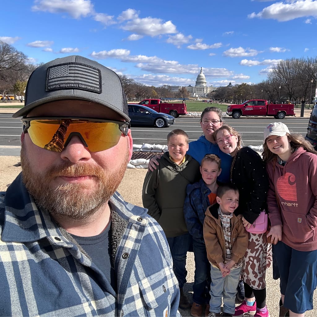 family of homeschoolers in front of the capitol building in DC