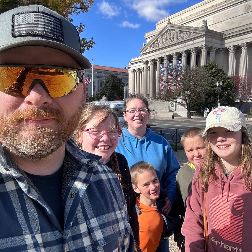 homeschool family standing in front of the national archives building