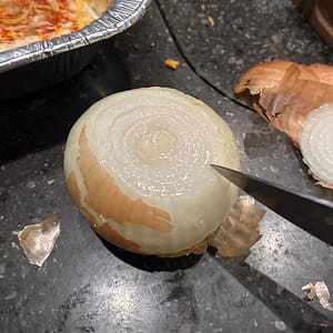 slice your Visalia onion to remove the outer layer