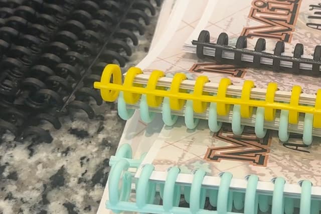 off brand binding machine leaves excess comb hanging off the end