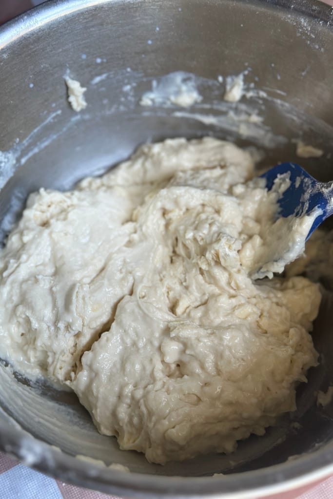 wet dough that is ready to be kneaded