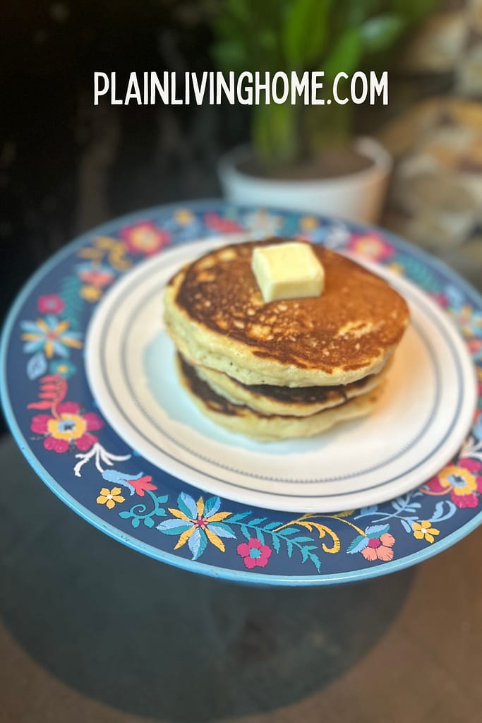 fluffy stack of pancakes with butter