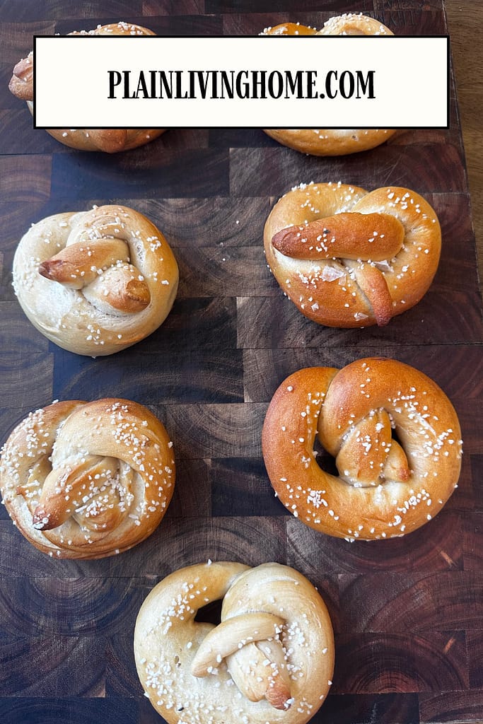 sourdough soft pretzels on a wooden cutting board