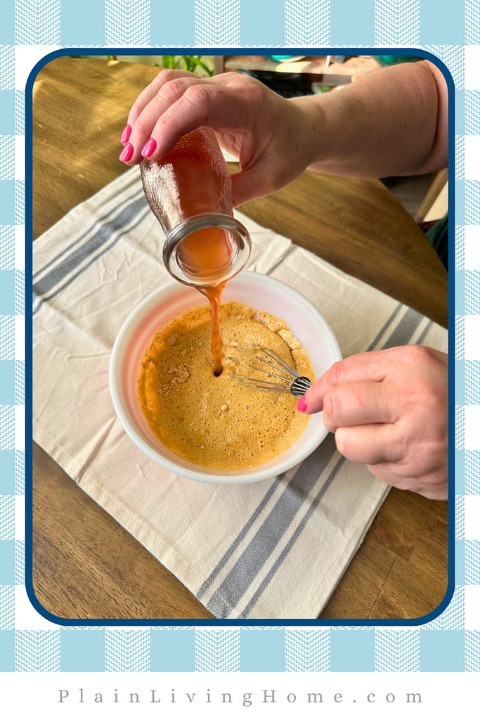 pouring vinegar into the dry ingredients