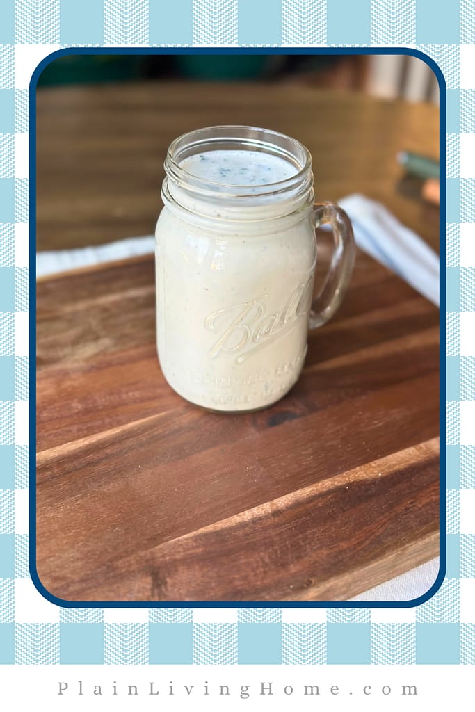 pour the ranch dressing into a jar with a lid