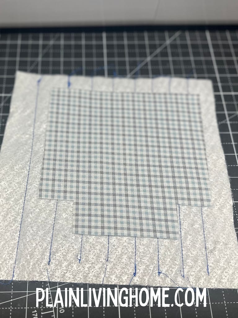 Cut the quilted panel out with the jar cozy template