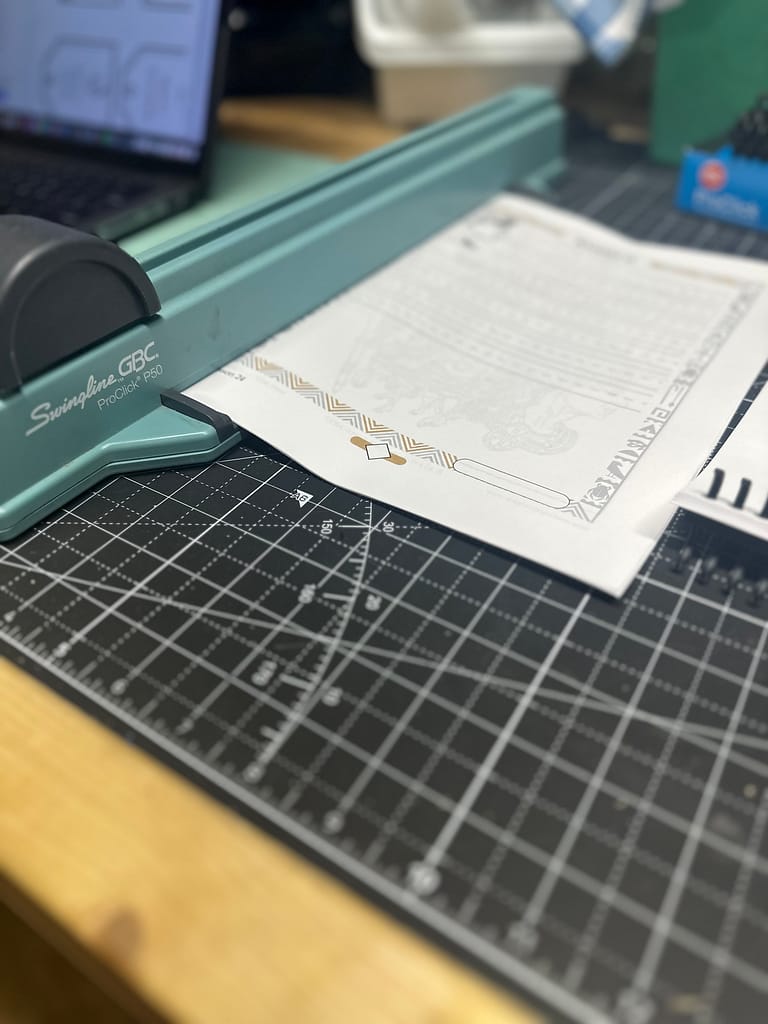 pages of a history curriculum inserted into the GBC pro click binding machine