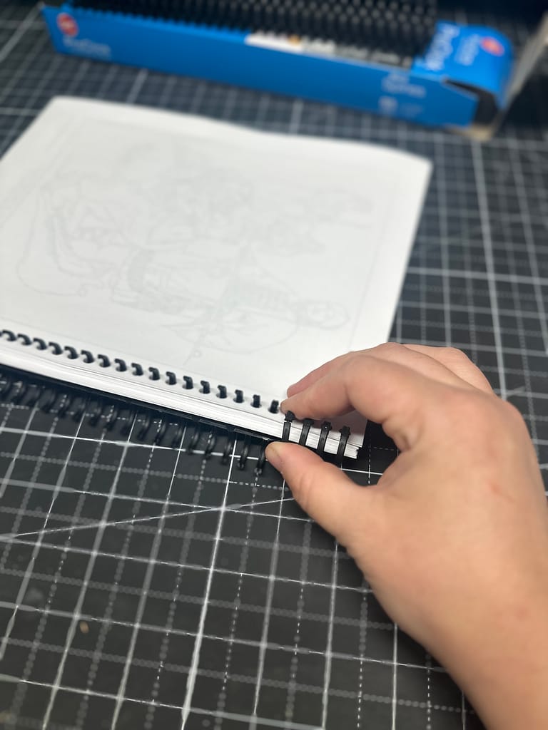 snap the combs closed on a spiral bound workbook