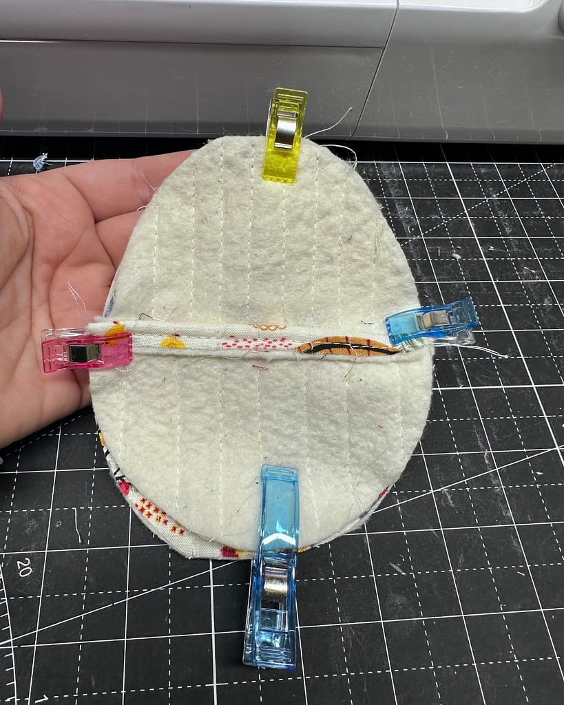 how to layer the quilted pieces of the fabric Easter egg for sewing