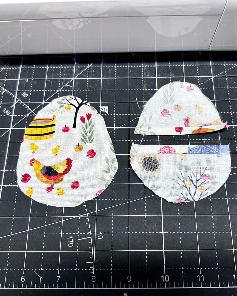 single layer fabric egg pieces, top pieces have narrow hem on the flat edge