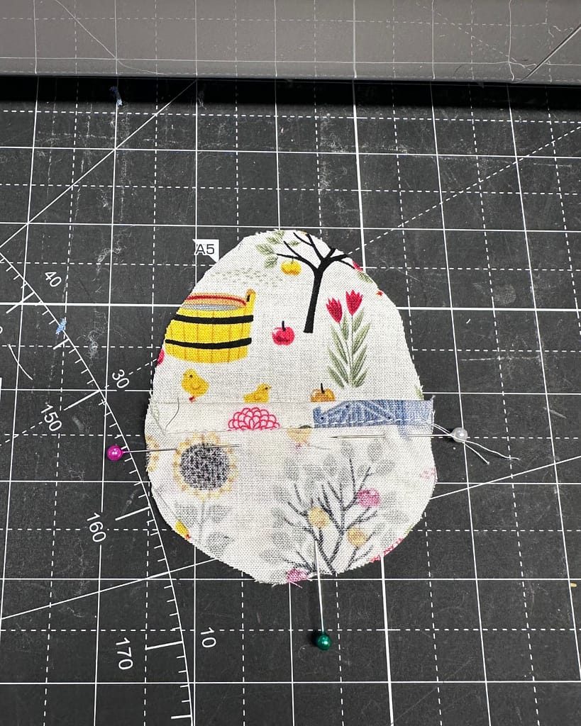 fabric egg pieces layer with pretty sides touching, hems can jsut touch or overlap in the middle